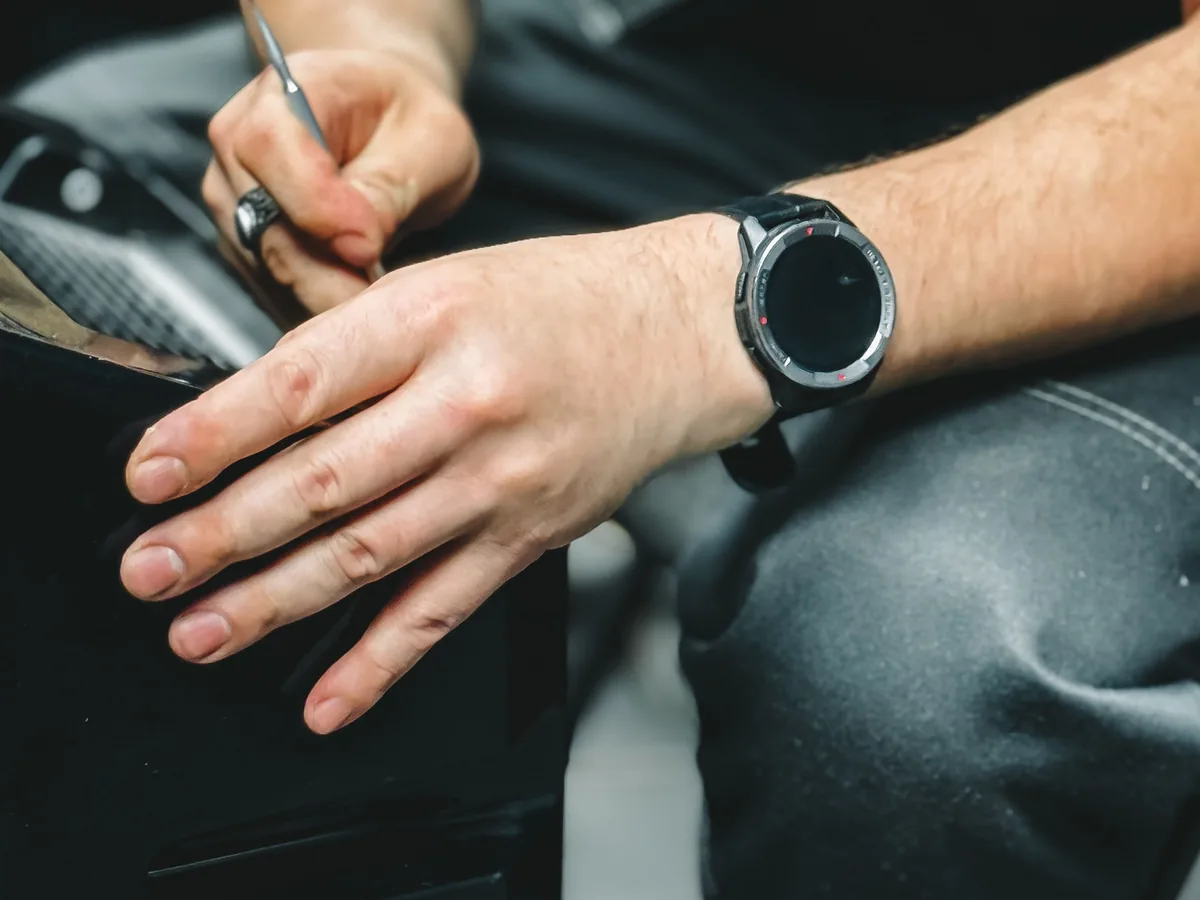 Close view of artisan hands shaping leather at a workbench